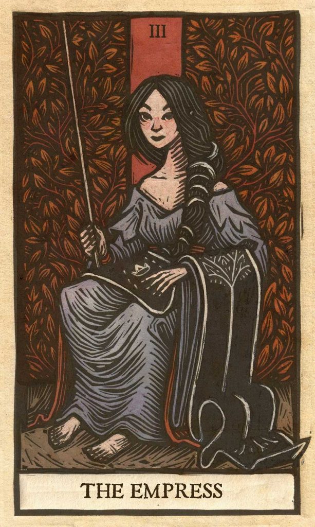 Carta del tarot La Emperatriz en estilo grabado, mujer sentada con cetro y fondo ornamental.