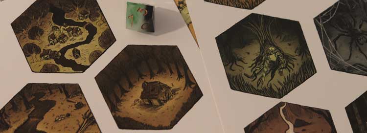 Mapa con hexágonos ilustrados de El Caballo Blanco de Vallebajo y dado de rol sobre el tablero